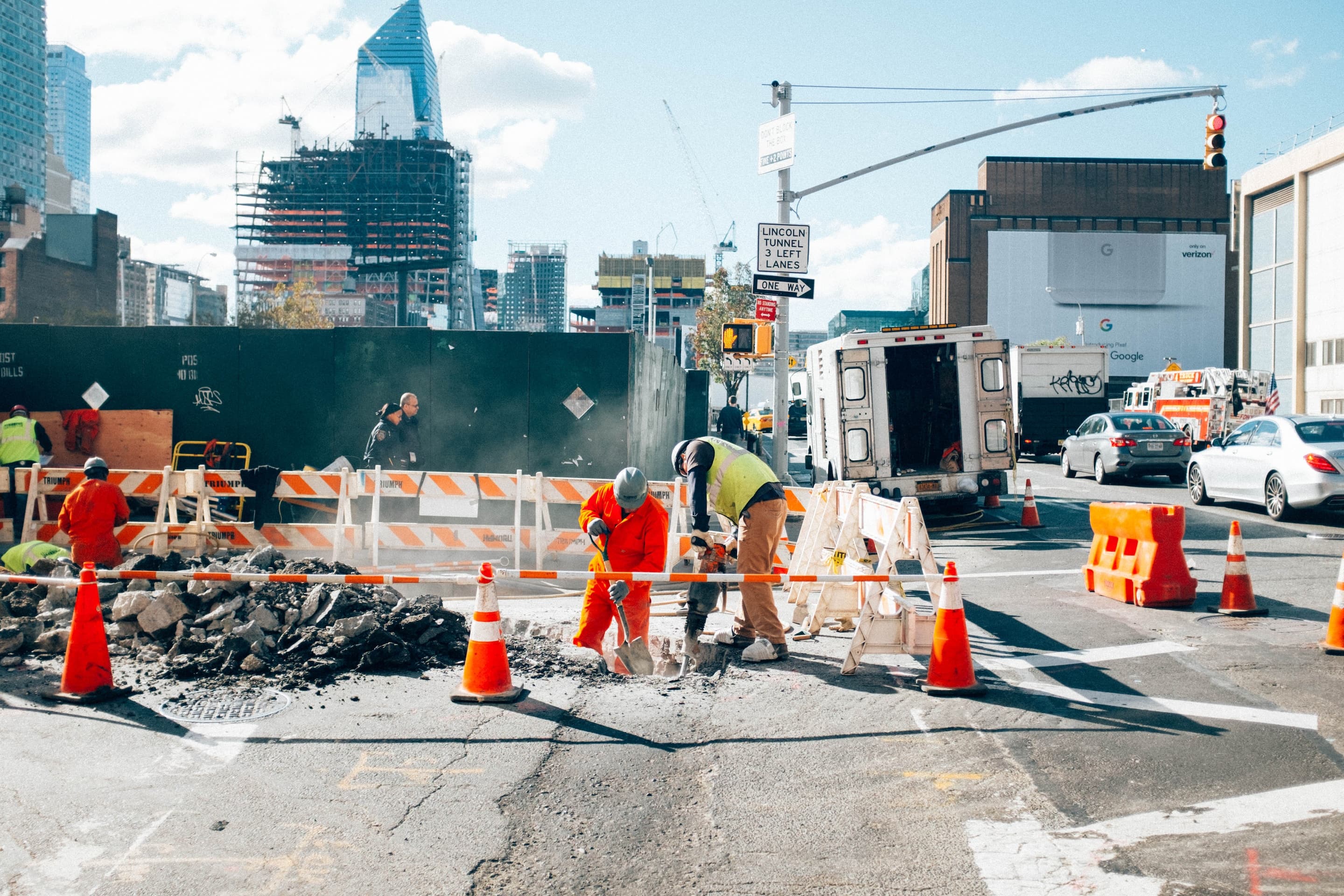 Construction workers repairing a city street in New York